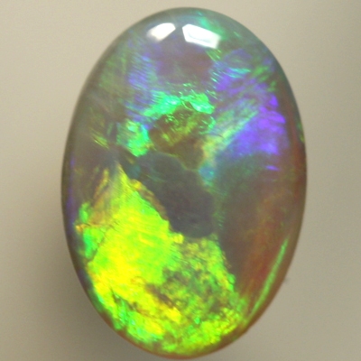 SOLID SEMI BLACK OPAL Large rolling flashes from orange to green with purple